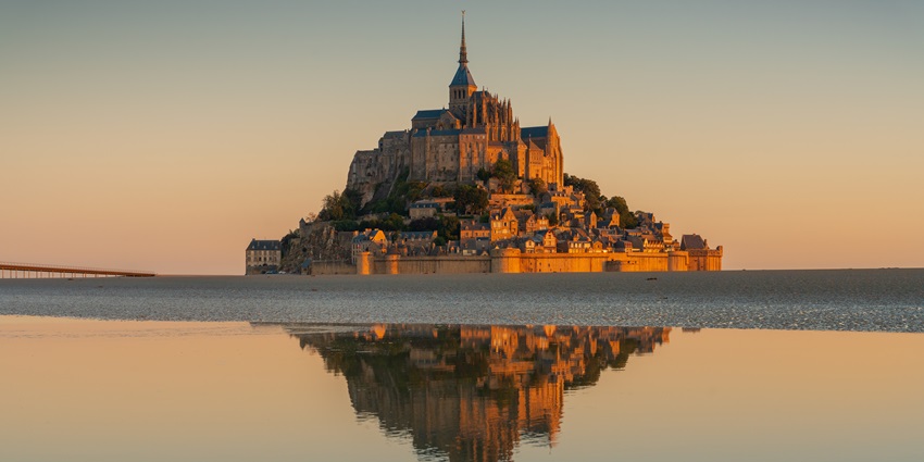The Mont Saint-Michel abbey, above the bay in Normandy, is one of the monuments in France.