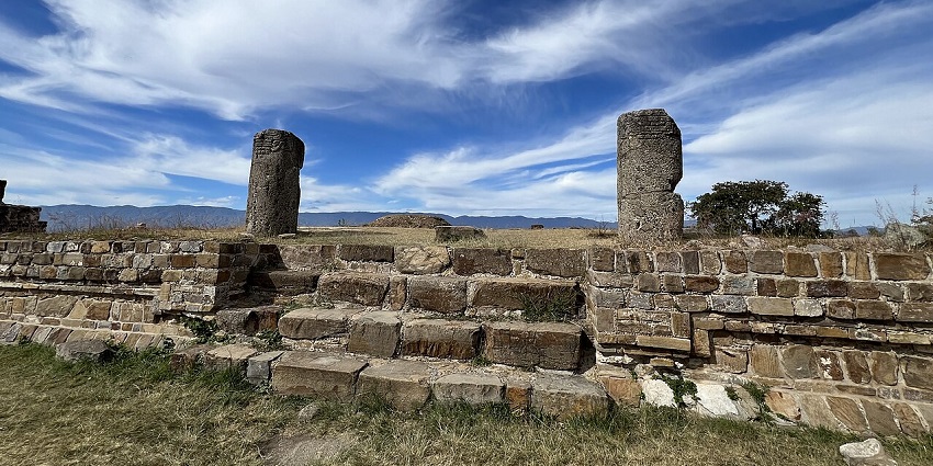 Monte Alban with ruins, broken pillars, walls, stone stairs, one of the famous historical places in Mexico.