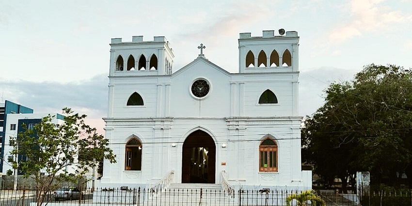 A white, twin-towered church with arched windows, one of the places to visit in Dominican Republic