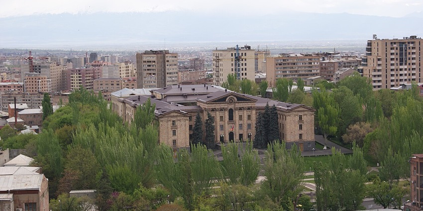 Panoramic view of the National Assembly building featuring modern design and greenery.