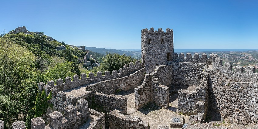 Stone walls and ancient towers of the Moorish Castle with views of Gibraltar town below