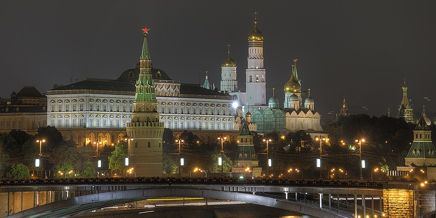 Night view of the Kremlin complex, an iconic monument in Russia, over the Moskva River.