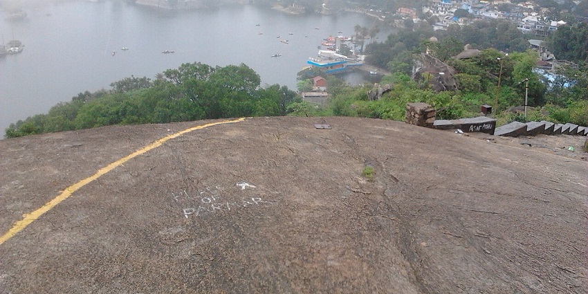 Mount Abu wildlife sanctuary from above with the water body of Nakki Lake and greenery.