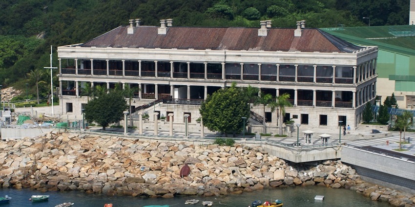 Victorian-era granite building relocated to Stanley waterfront, now housing restaurants and shops.