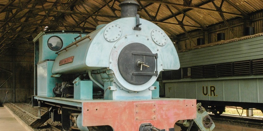 Vintage locomotives and colonial-era train cars at the Nairobi Railway Museum.