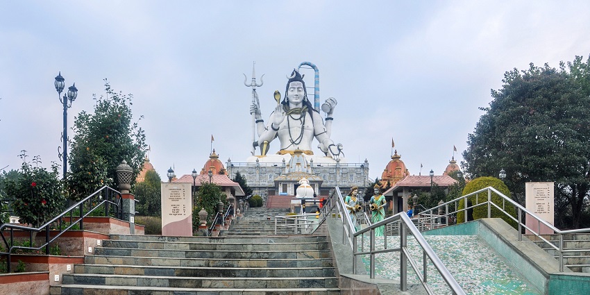 Char Dham complex in Namchi shows a large Shiva statue and temple replicas on the hilltop, one of the top places to visit in Gangtok in June.