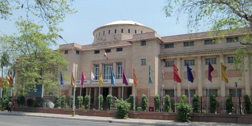 National Museum entrance with Indian flag and multiple flags, one of the places to visit in Delhi in June