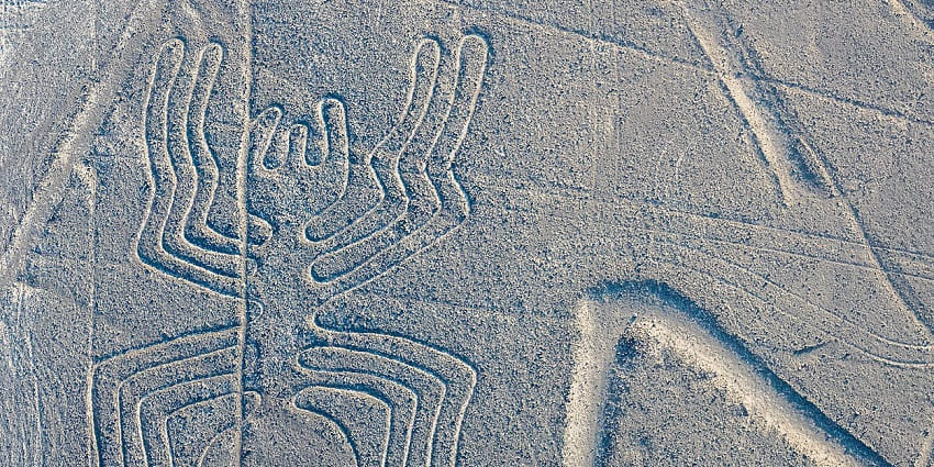 The Nazca lines from above in the Nazca desert with a unique structure of lines forming a spider