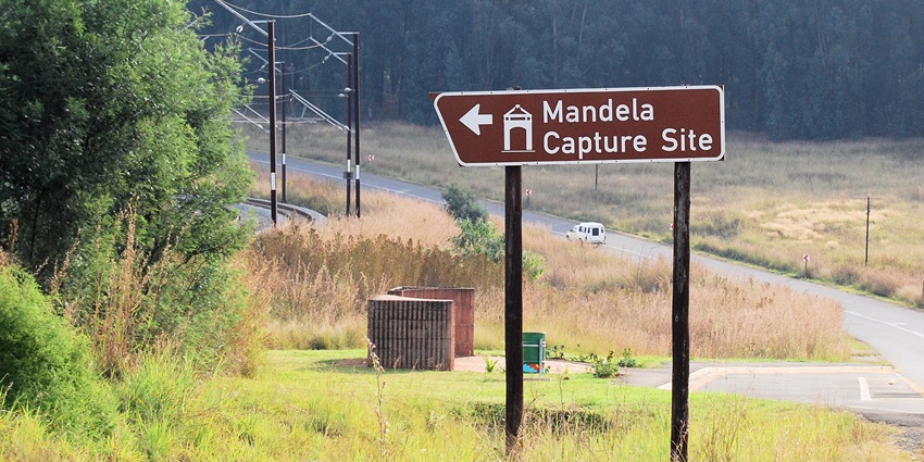 Tall steel rods align to form Nelson Mandela’s face, monuments in South Africa.
