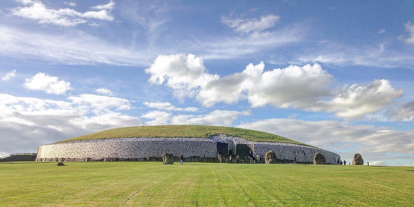 Front view of Newgrange monument, ancient stone structure with intricate carvings