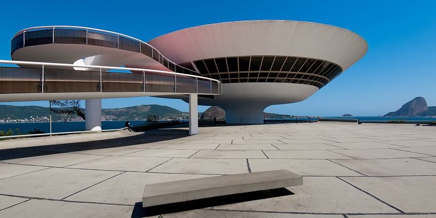 The futuristic structure of the Museum of Contemporary Art is on a cliffside in Brazil.