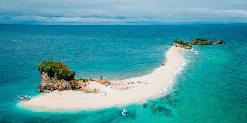 A small tropical island surrounded by clear blue sea and white sandy shores, one of the most beautiful islands in Madagascar.