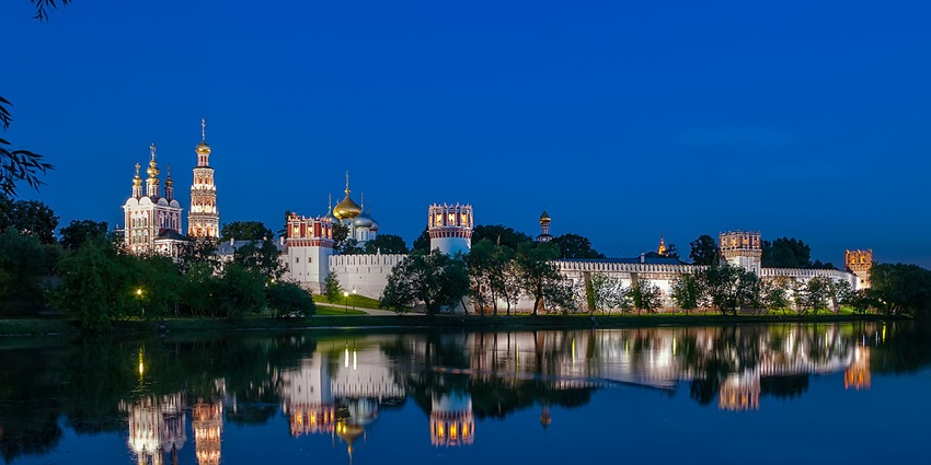 Novodevichy Convent at night in Moscow with the magnificence reflecting in the water