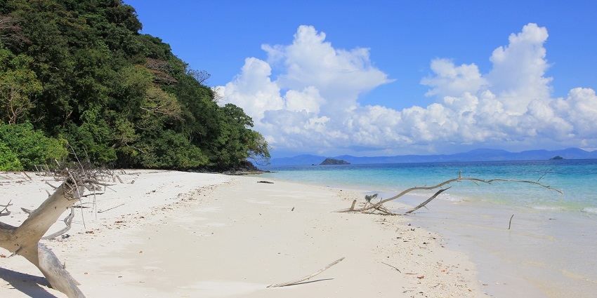 Nyaung Oo Phee Island with coral reefs and lush green, one of the top islands in Myanmar.