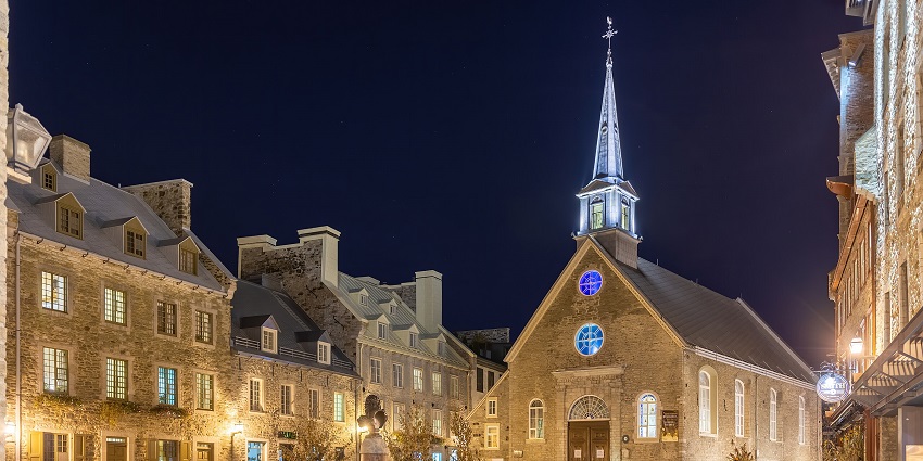 Palace royale at night in old Quebec with traditional architecture and lit-up streets