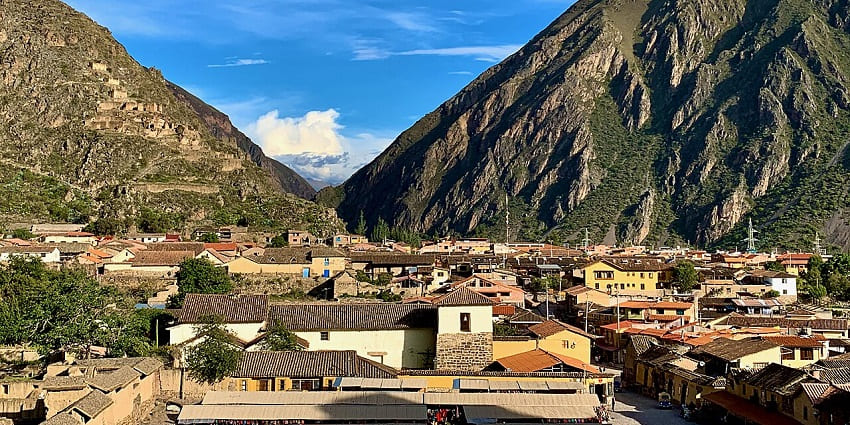 Ollantaytambo Valley with the traditional architecture of vibrant houses and tall mountains, one of the historical places in Peru.