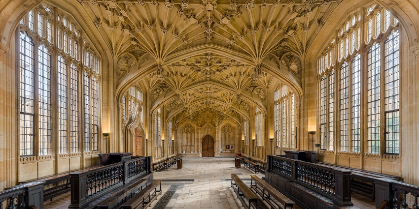 Interior of Oxford’s Bodleian Library with detailed architecture of ceiling and tables