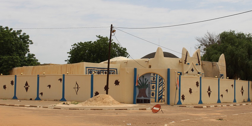 Entrance of the Palace of the Zarmakoye of Dosso with unique designs on the walls and trees