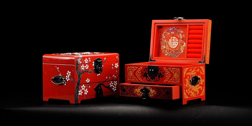 Lacquered boxes featuring intricate folk tales in miniature painting style, one of the popular things to buy in Russia.