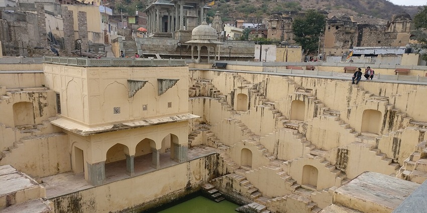 Geometric stepwell with symmetrical stairs, reflecting ancient water conservation techniques.