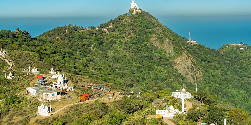 Scenic mountain trail with stone steps and forest views, one of the best places to visit in Jharkhand in December.