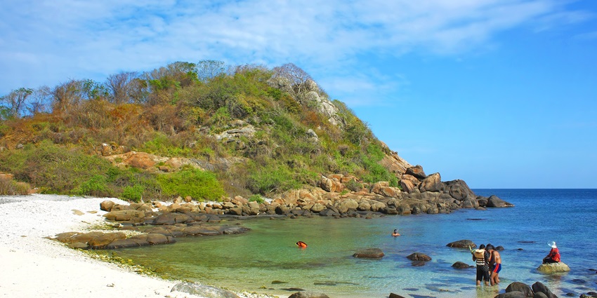 Pigeon Island National Park with clear waters, coral reefs, and a rocky shoreline