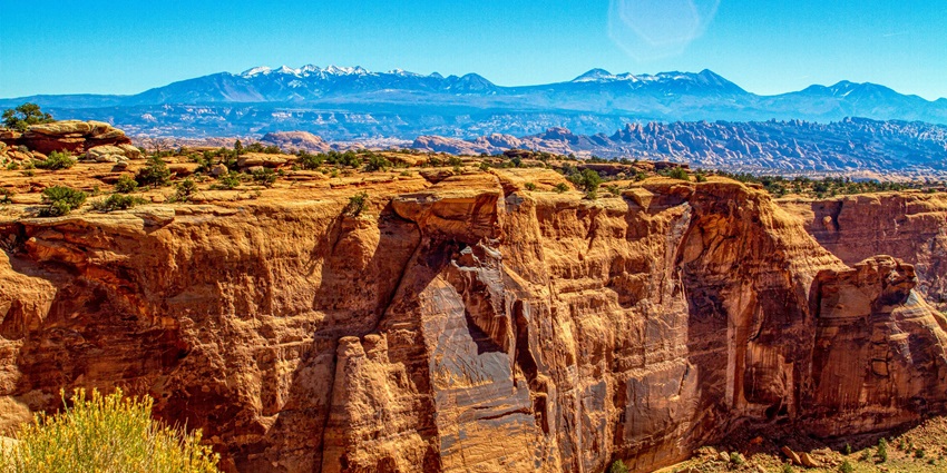 Things to do in Utah in summer include camping beneath towering red rock arches.
