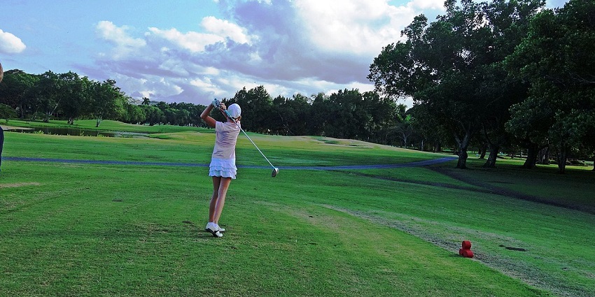 Scenic course surrounded by tropical greenery and open skies, showcasing a top place to visit in Dominican Republic.