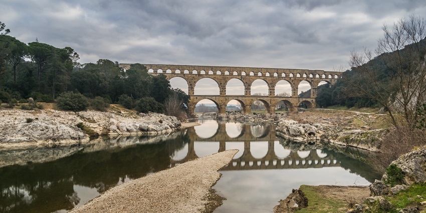 Roman aqueduct bridge crossing a river on the Pont du Dard, southern Paris, France.