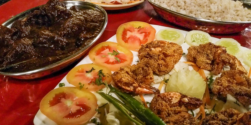 What is the famous food of Goa? The Fiery red pork vindaloo with meat marinated in vinegar
