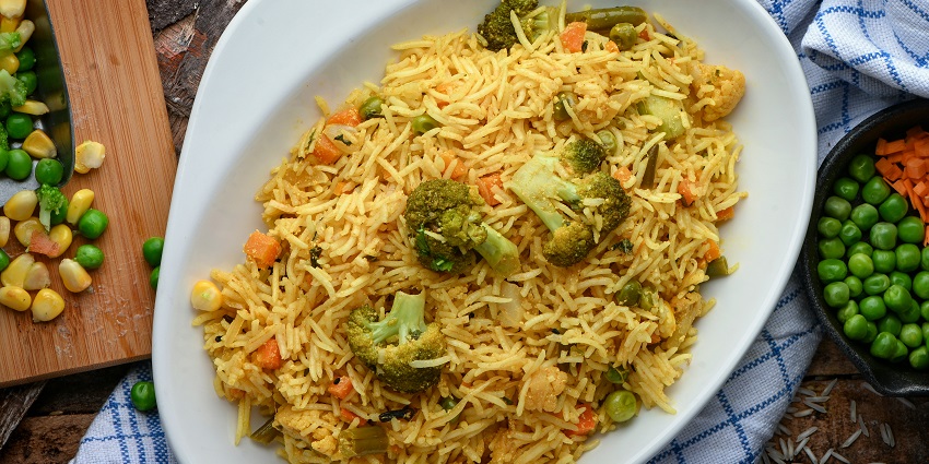 Pulao and chhanar dalna served in a Bengali meal showing what is the main food of Kolkata