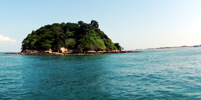 Remote, untouched rocky outcrop of Pulau Jong, inaccessible but visible by boat.