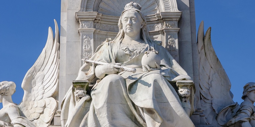 A close-up view of the Queen Victoria statue, showcasing regal detail and symbolic figures, is a prominent colonial-era monument in New Zealand.