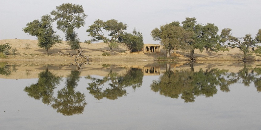 Peaceful lakeside view of Rambha with distant green hills