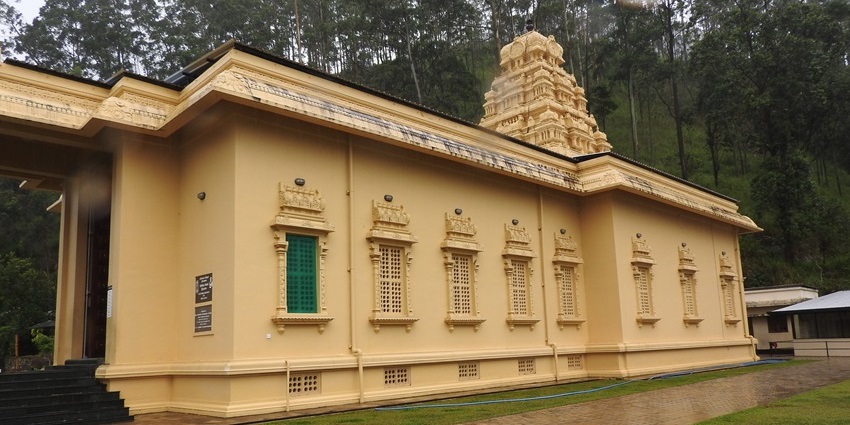 Bhakta Hanuman temple with traditional yellow architecture and intricate carvings