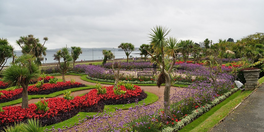 Vibrant flowers and scenic view in Winchester’s Abbey Gardens.