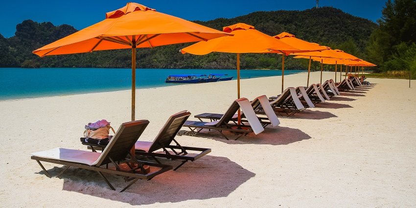 Soak up the sun and tropical energy on the popular sandy shores of Playa del Carmen.