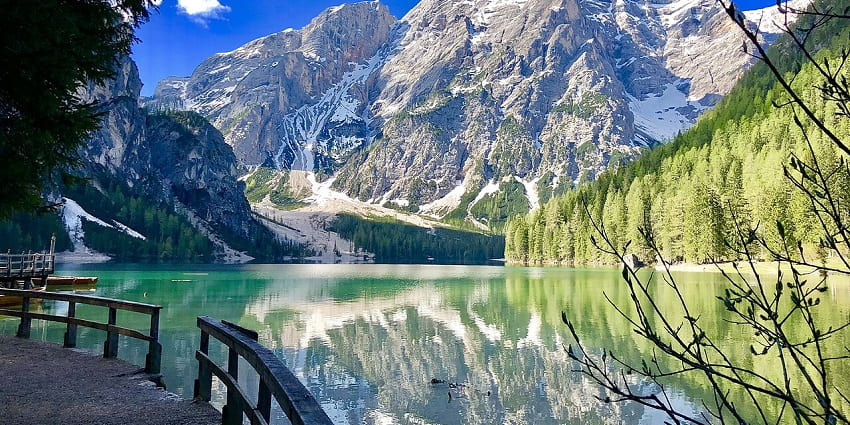 Exploring the turquoise Lago di Braies is one of the best things to do in Dolomites.