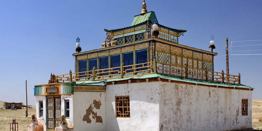 Khamar Monastery with old architecture, a green roof, a small entrance gate and windows