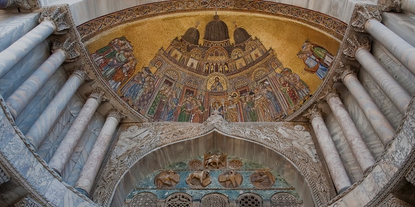 Door of Saint Mark’s Basilica in Venice with the detailed architecture of the ceiling