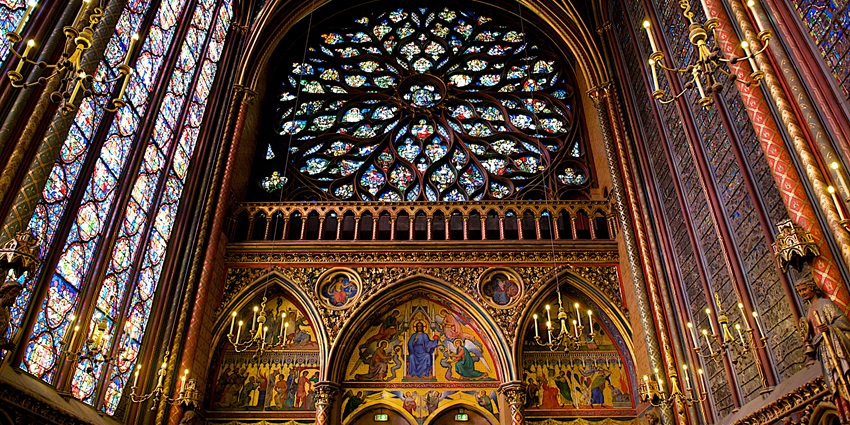 The interior of Sainte-Chapelle, glowing with colourful stained-glass windows in France