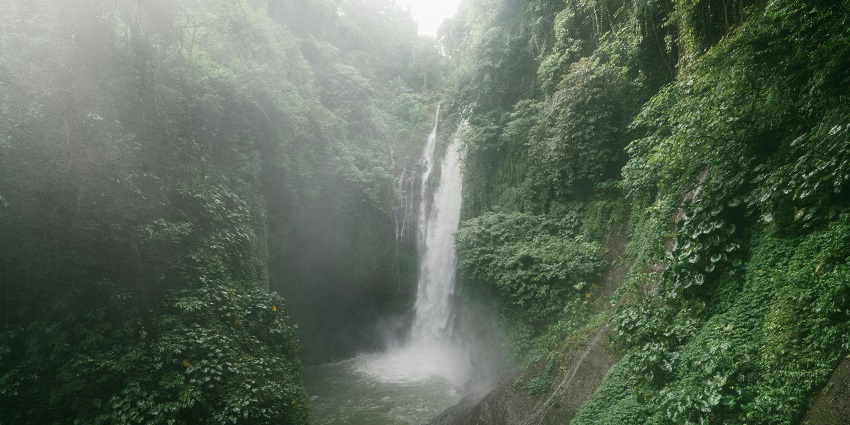 Sambangan secret garden with water natural pool and small waterfalls flowing into pool.