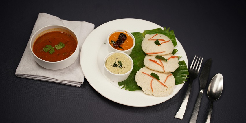Goan sannas, steamed rice cakes, are often paired with spicy curries and pork dishes.