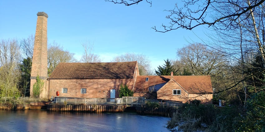 The watermill surrounded by greenery at Sarehole Mill is one of the historical places in Birmingham.