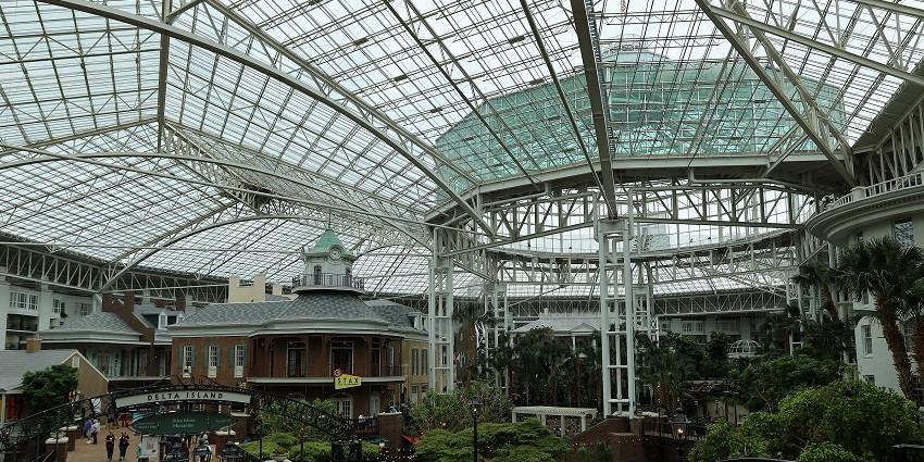 Enjoying festive decorations, lights, and country-themed holiday attractions at Opryland Resort, one of the top things to do in Nashville in December.