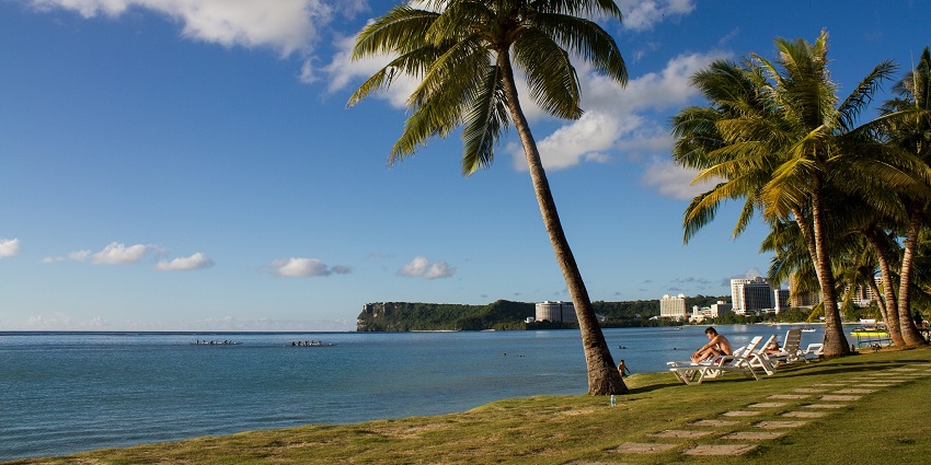 A remote and pristine Say Tan Island with rocky outcrops and calm emerald waters.
