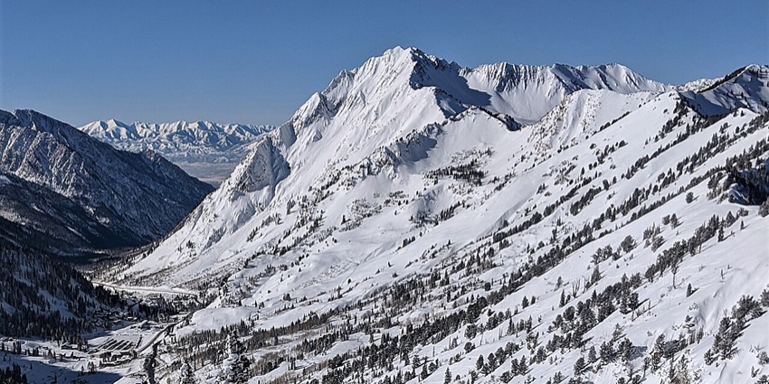 Rock climbers tackle sheer granite faces while surrounded by alpine views near Salt Lake City.