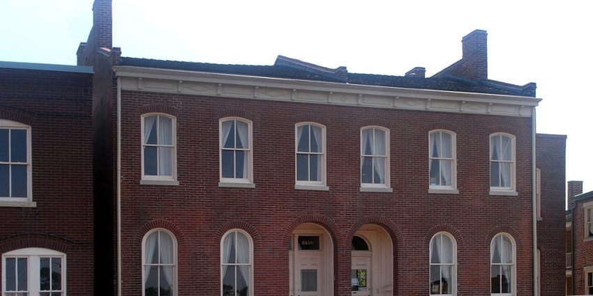 Scott Joplin House, state historic site with an old red building, two gates and multiple windows