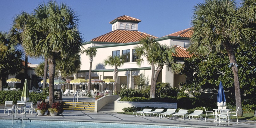 Guests enjoying luxury golf resorts and elegant beaches on the exclusive Sea Island.