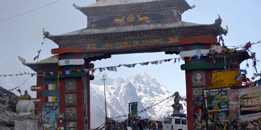 Sela Pass with the entrance gate, Tibetan flags, one of the top places to visit in Tawang in January.